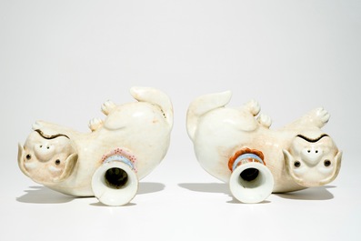 A pair of Chinese famille rose dog-shaped candle holders, 18/19th C.