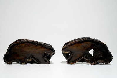 A pair of Chinese famille rose dog-shaped candle holders, 18/19th C.