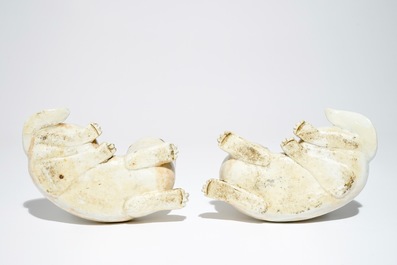 A pair of Chinese famille rose dog-shaped candle holders, 18/19th C.