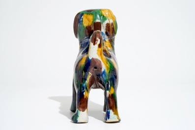 A Chinese spinach and egg glazed model of a dog on stand, 19th C.