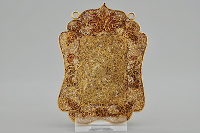 A Chinese gilt filigree silver hat ornament with jade inset, 19/20th C.