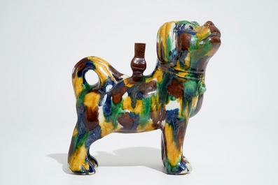 A Chinese spinach and egg glazed model of a dog on stand, 19th C.