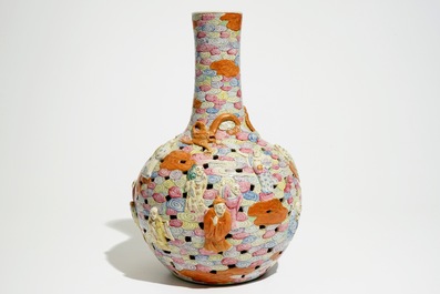 A Chinese famille rose reticulated bottle vase with figures, 19th C.