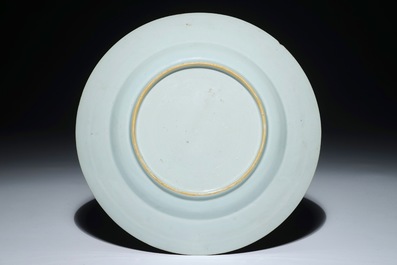 A Chinese rose-Imari plate with a Long Eliza and her servant holding a parasol, Yongzheng