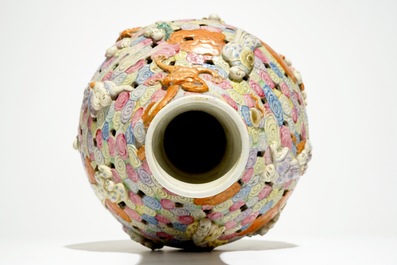 A Chinese famille rose reticulated bottle vase with figures, 19th C.