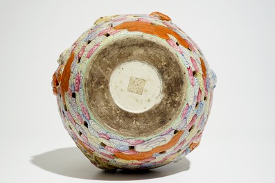 A Chinese famille rose reticulated bottle vase with figures, 19th C.