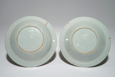 A pair of unusual Dutch Delft deep plates with fruit design, 18th C.