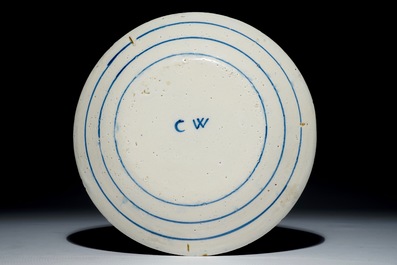 A Dutch Delft blue and white armorial plate, 17th C.
