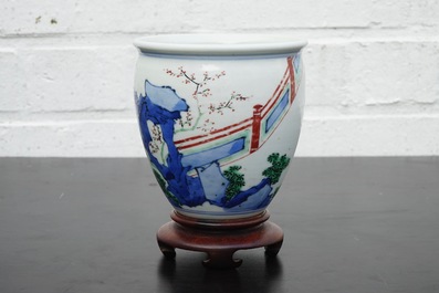A Chinese wucai brush pot on wooden stand, Transitional period