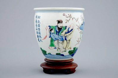 A Chinese wucai brush pot on wooden stand, Transitional period