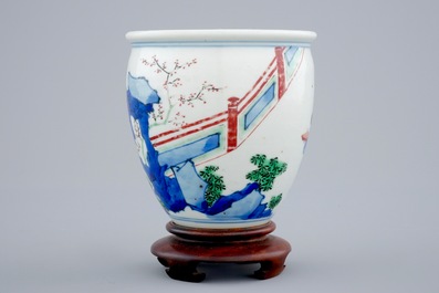 A Chinese wucai brush pot on wooden stand, Transitional period
