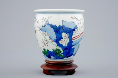 A Chinese wucai brush pot on wooden stand, Transitional period