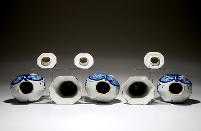 A Dutch Delft blue and white five-piece garniture with a hunter, 19th C.