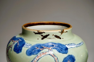 A pair of Chinese celadon, copper-red and underglaze blue vases and covers, Kangxi