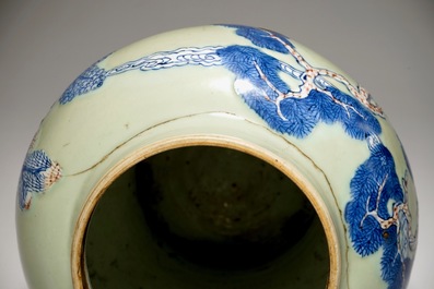 A pair of Chinese celadon, copper-red and underglaze blue vases and covers, Kangxi
