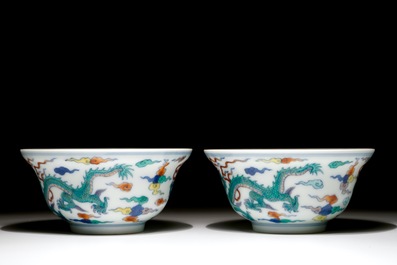 A pair of Chinese doucai "dragon" bowls, Yongzheng mark, 20th C.