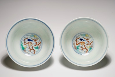 A pair of Chinese doucai "dragon" bowls, Yongzheng mark, 20th C.
