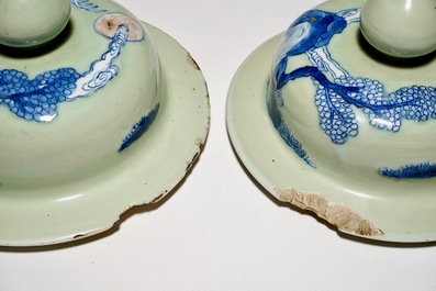 A pair of Chinese celadon, copper-red and underglaze blue vases and covers, Kangxi