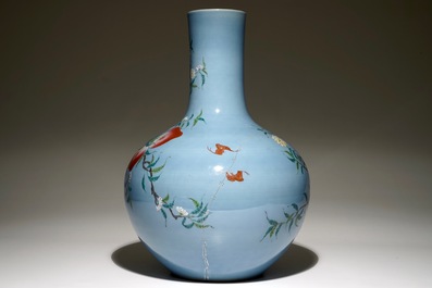 A Chinese famille rose blue ground tianqiuping &ldquo;Nine peaches&rdquo; vase, 19/20th C.