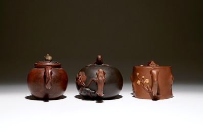 A set of three Chinese Yixing teapots, 20th C.