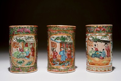 Three Chinese Canton rose medallion relief-decorated and pierced brushpots, 19th C.