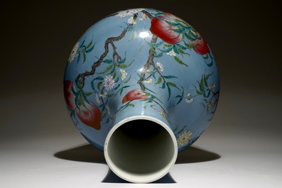 A Chinese famille rose blue ground tianqiuping &ldquo;Nine peaches&rdquo; vase, 19/20th C.