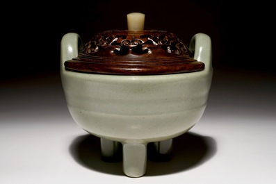 A Chinese tripod celadon censer with jade-inset wooden cover, 19th C.