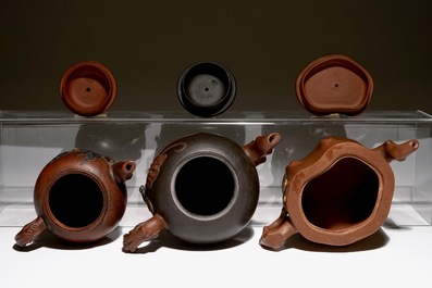 A set of three Chinese Yixing teapots, 20th C.