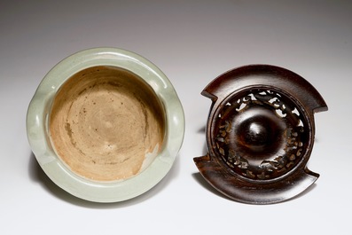 A Chinese tripod celadon censer with jade-inset wooden cover, 19th C.