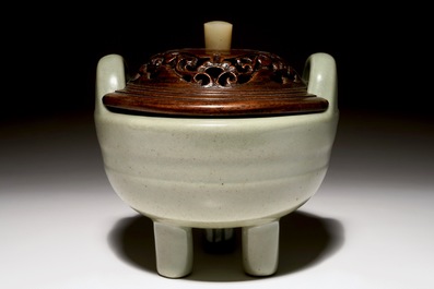 A Chinese tripod celadon censer with jade-inset wooden cover, 19th C.