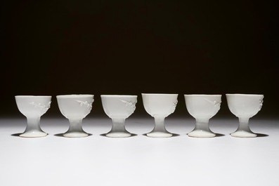 Six Chinese blanc de Chine stem cups with applied floral sprigs, 18/19th C.