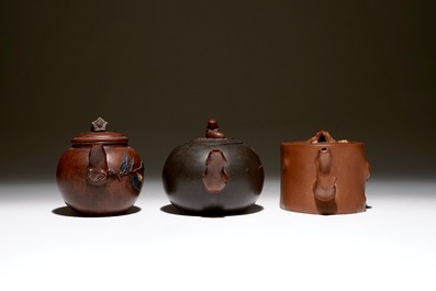 A set of three Chinese Yixing teapots, 20th C.