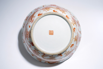 A large Chinese famille rose "dragon" bowl on a wooden stand, 20th C.