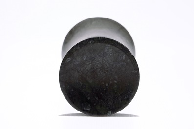 A Chinese bamboo opium pipe, a dark hardstone chalice and a silver belt buckle, 19/20th C.