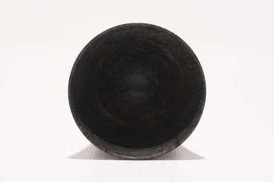 A Chinese bamboo opium pipe, a dark hardstone chalice and a silver belt buckle, 19/20th C.