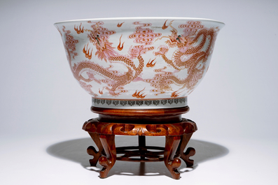 A large Chinese famille rose "dragon" bowl on a wooden stand, 20th C.
