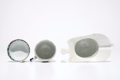 A Chinese famille rose jug, a cup and saucer and another cup with ear, 18th C.