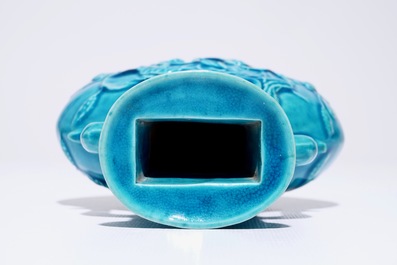 A Chinese turquoise relief-decorated moonflask with relief design, 19th C.