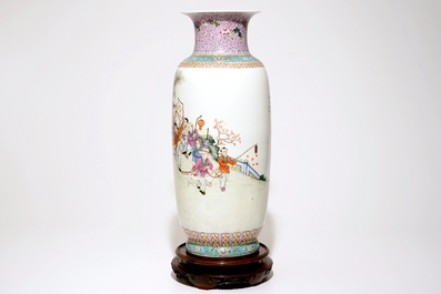 A large Chinese famille rose vase with playing boys, on a wooden stand, 20th C.