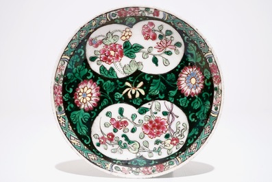 A Chinese famille rose jug, a cup and saucer and another cup with ear, 18th C.