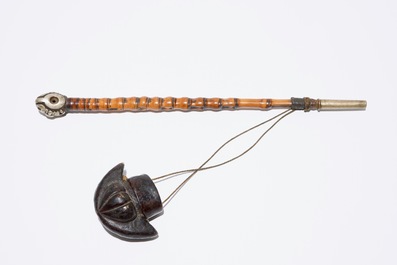 A Chinese bamboo opium pipe, a dark hardstone chalice and a silver belt buckle, 19/20th C.