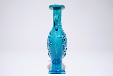 A Chinese turquoise relief-decorated moonflask with relief design, 19th C.