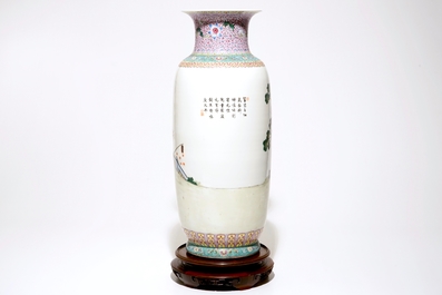 A large Chinese famille rose vase with playing boys, on a wooden stand, 20th C.