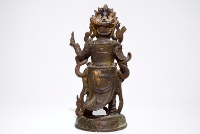 Une grande figure en bronze dor&eacute;, traces de polychrome, Ming