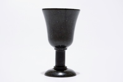 A Chinese bamboo opium pipe, a dark hardstone chalice and a silver belt buckle, 19/20th C.