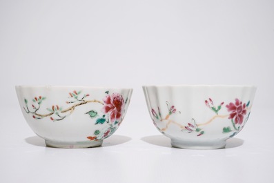 A pair of Chinese famille rose cups and saucers with peacocks, Qianlong