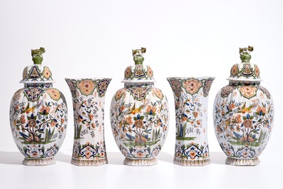 Une garniture de cinq vases en fa&iuml;ence de style Delft polychrome, France, 19&egrave;me