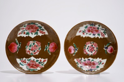 A pair of Chinese famille rose capucin ground cups and saucers, Qianlong