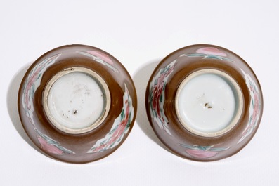 A pair of Chinese famille rose capucin ground cups and saucers, Qianlong