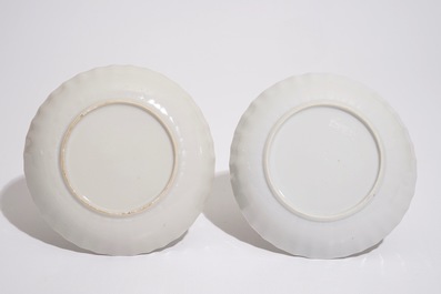 A pair of Chinese famille rose cups and saucers with peacocks, Qianlong